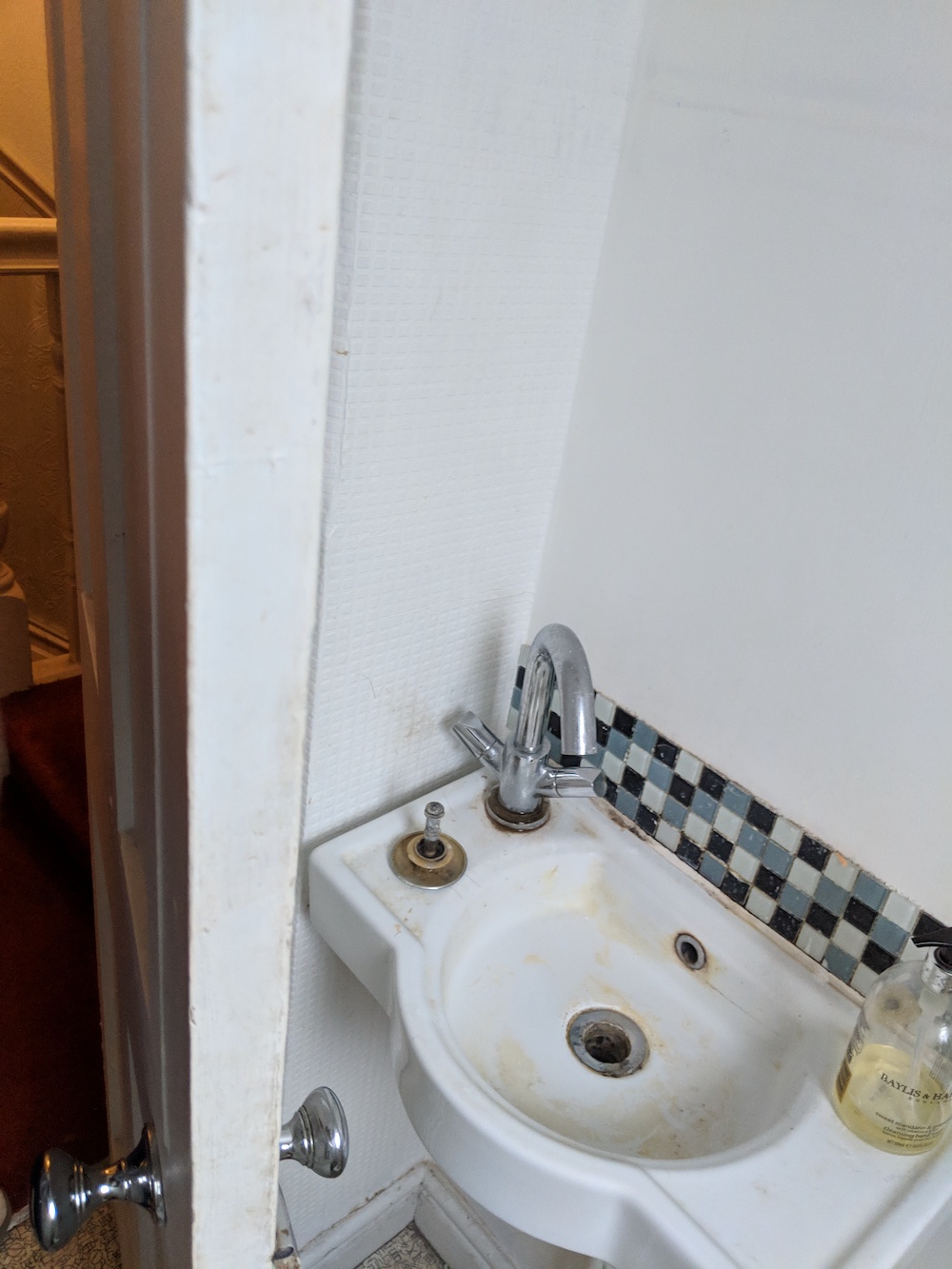 The tiny sink in the original toilet room